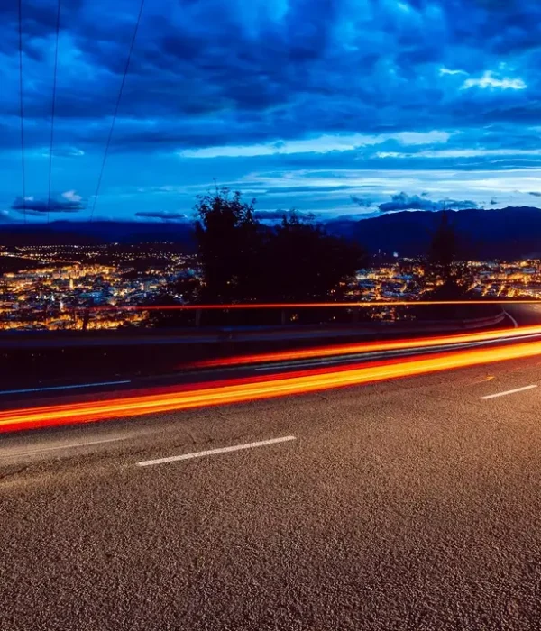 view-of-abstract-shines-on-road-at-night.webp